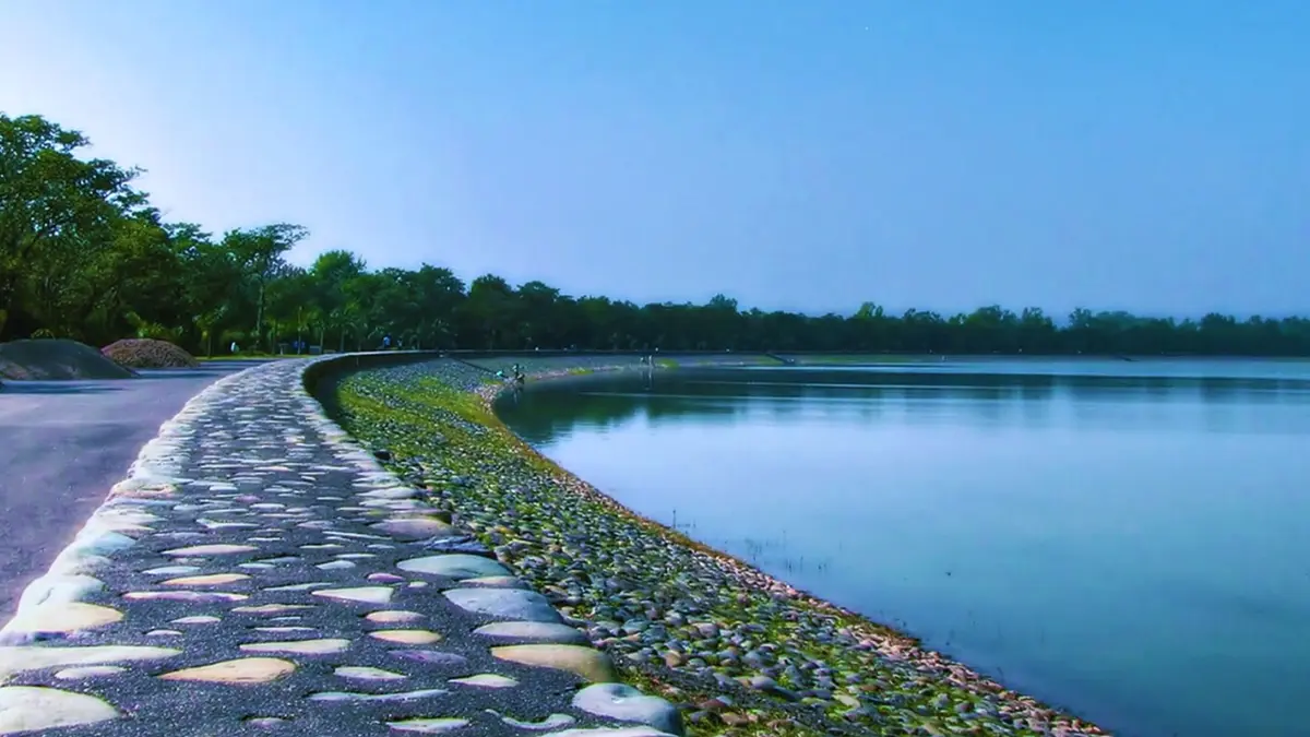 Peaceful walkway along the banks of Sukhna Lake Chandigarh