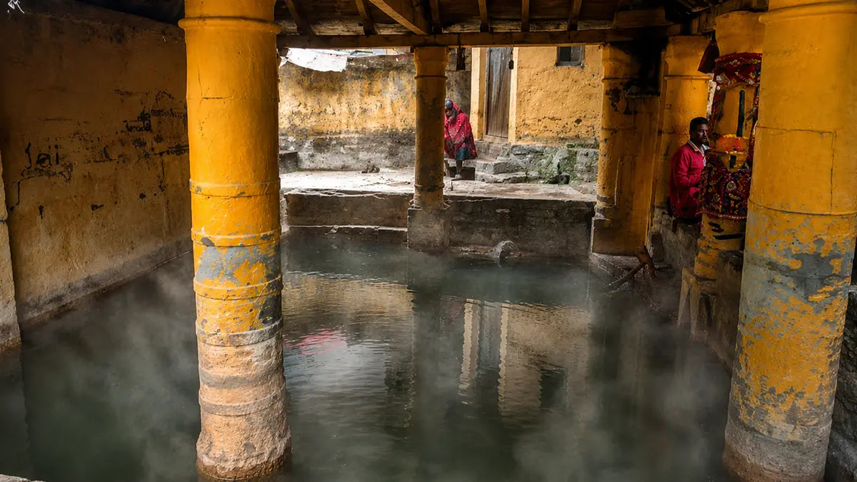 Pilgrims bathing at the sacred Tapt Kund natural hot spring near Badrinath Temple
