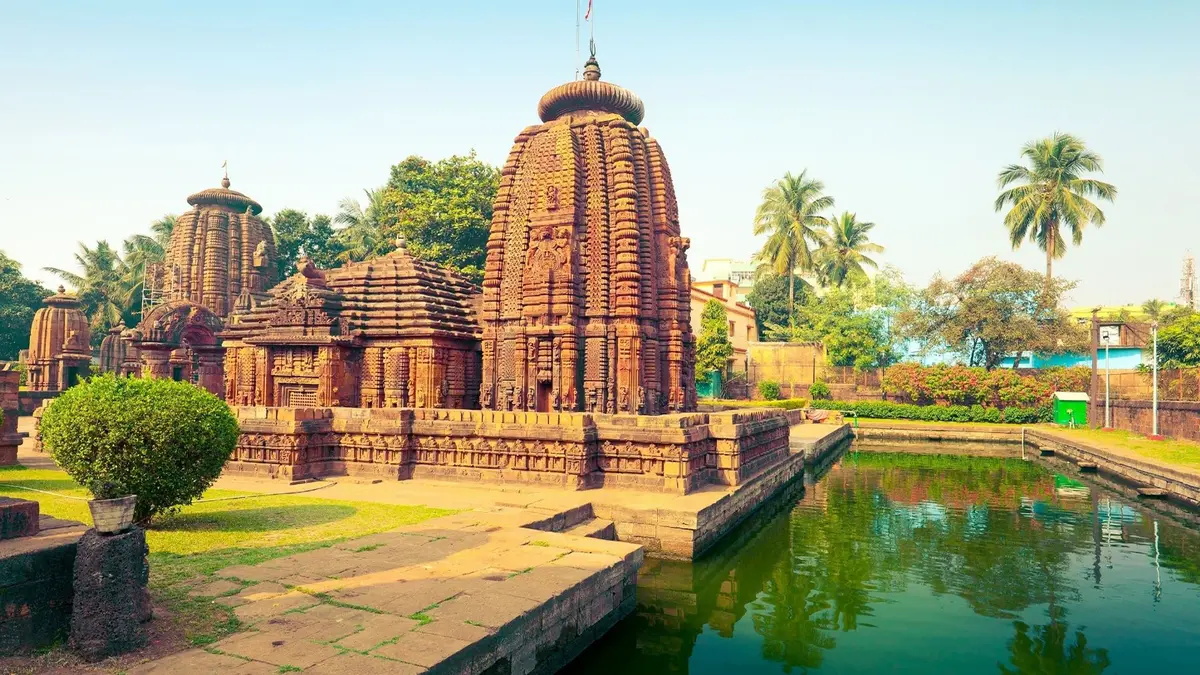 Historic temple ensemble reflected beside a traditional water tank