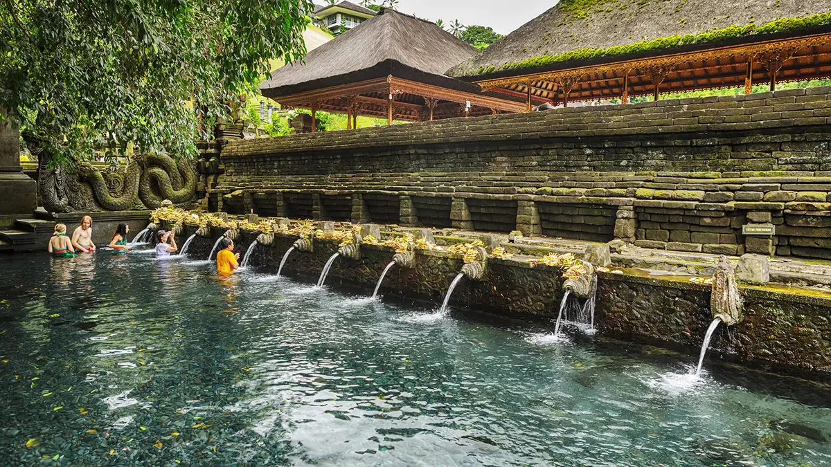 Visitors taking part in the sacred water purification ritual at Tirta Empul Temple in Bali