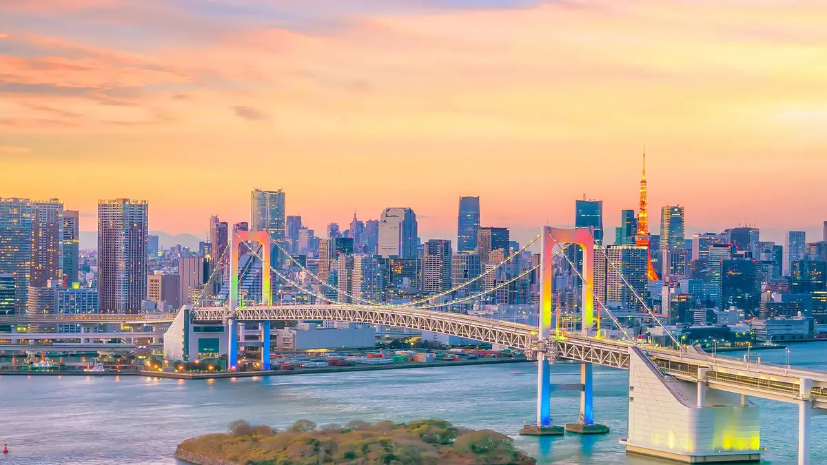 Rainbow Bridge and Tokyo skyline at sunset