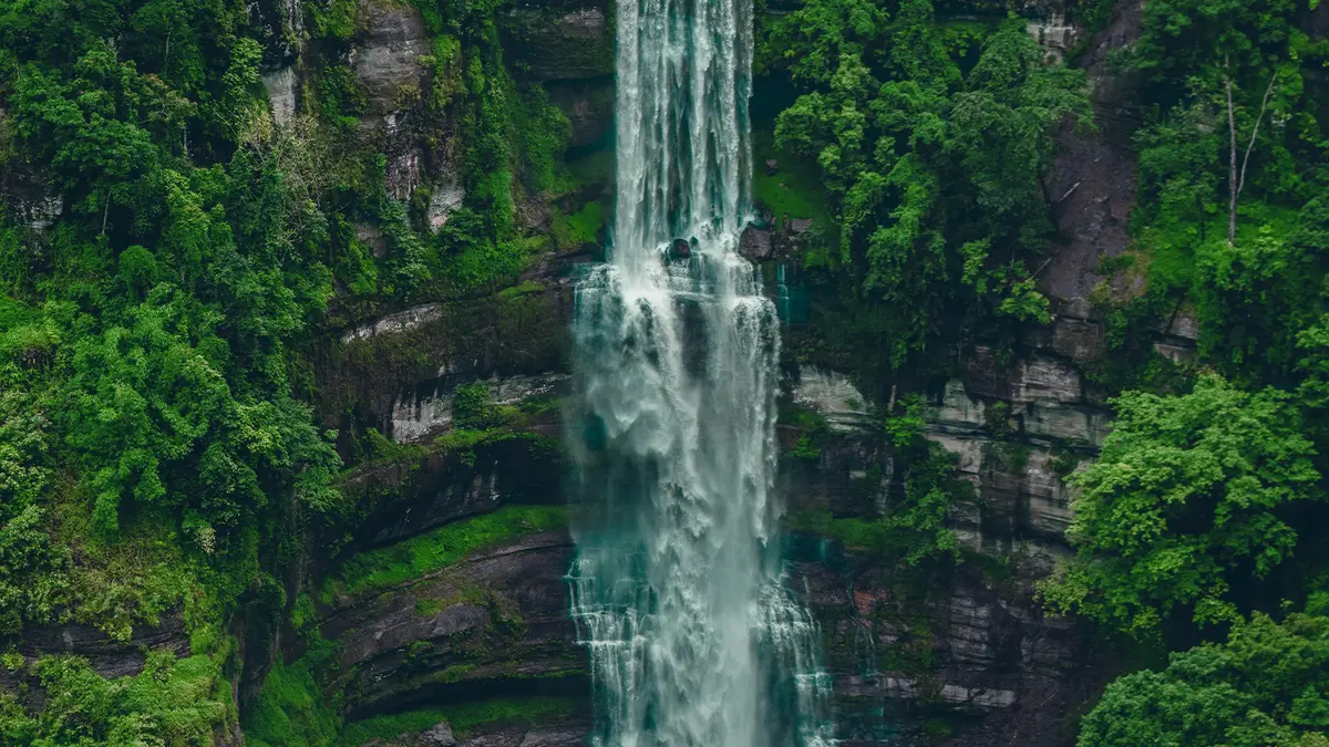 Towering Vantawng Falls cascading through tropical forest