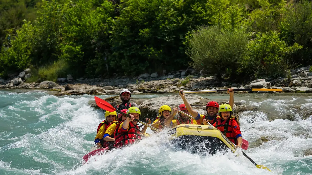 Adventure seekers enjoying white water rafting in a mountain river