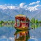 Kashmir Dal Lake shikara with snow-capped mountains