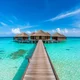 Maldives overwater villas above turquoise lagoon