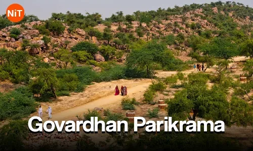 Pilgrims walking along the Govardhan Parikrama route