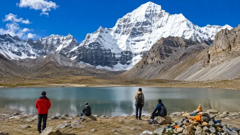 Man-made mountain reservoir surrounded by panoramic Himalayan peaks