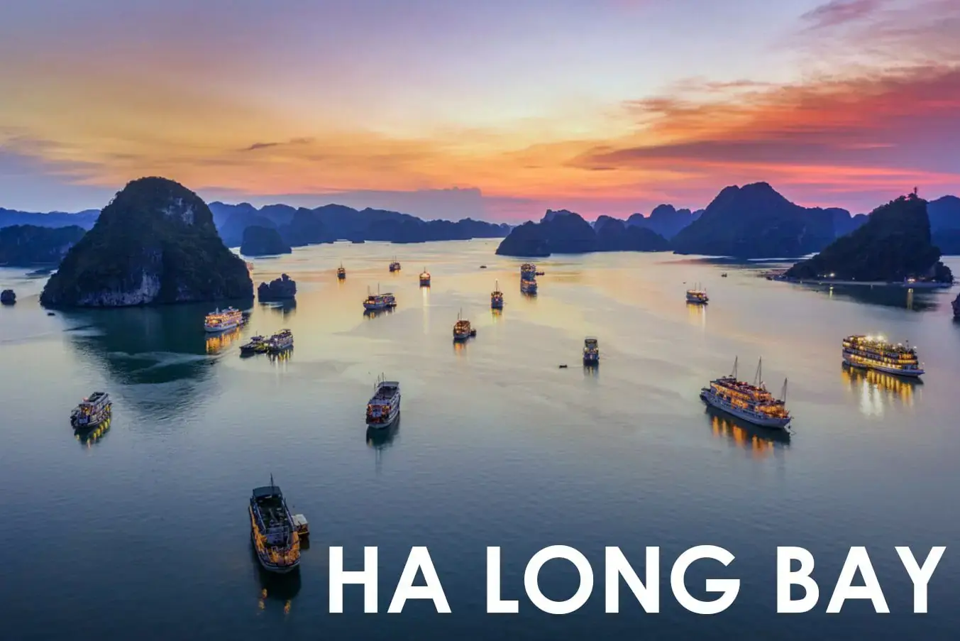 Ha Long Bay limestone islands rising from emerald waters in Vietnam